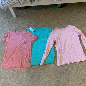 Three vineyard vines shirts